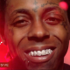 Lil Wayne “Cross Me” Feat. Future & Yo Gotti Official Music Video) la modelo con la vandera dominicana en la espalda